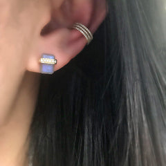 triple row ear cuff, worn with a colored stone stud