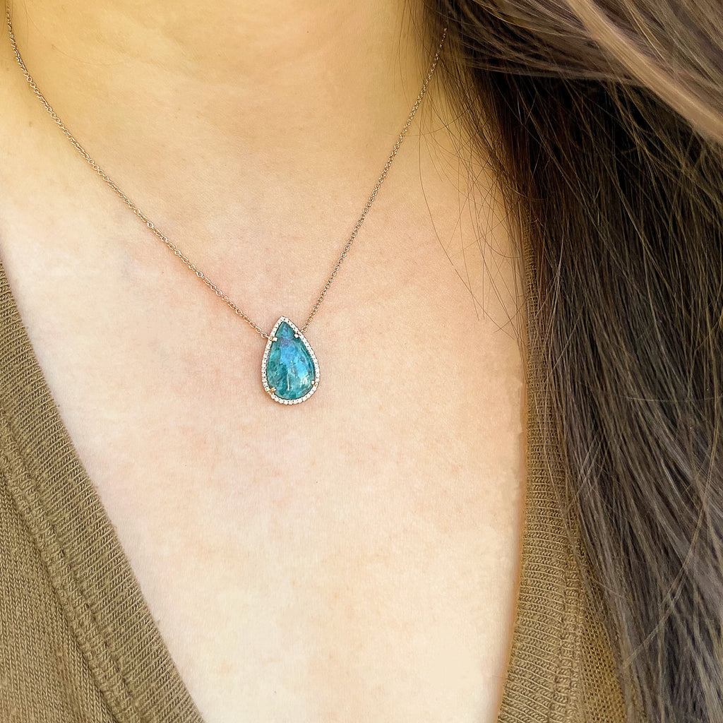 14k gold and diamond necklace with a pear shaped multicolor paraiba tourmaline center