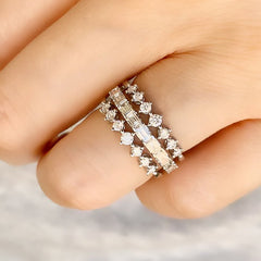 Seven stone bands stacked with a baguette halfway band for a coll bridal look