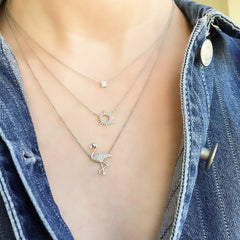 liven layers create a fun look with our sunshine necklace, a petite square and a fun flamingo