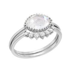 two ring set consisting of a bezel set marquise shaped rainbow moonstone, with a matching arch shaped ring of diamonds