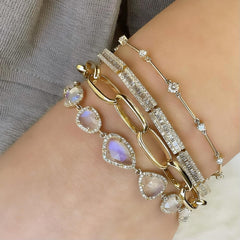 Icicle bracelet stacked with other timeless bracelets