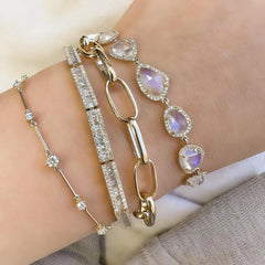 Icicle bracelet stacked with other timeless bracelets