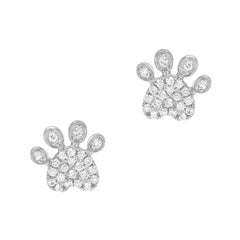 dog paw print stud earrings in gold and diamonds