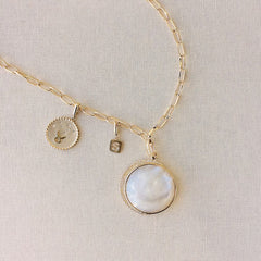 layer this charm on our hand made chain with other charms from our collection