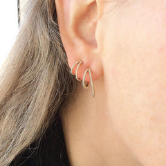 A dramatic look created by layeting both sizes of split hoops 