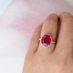 14k yellow gold and diamond ring with a natural ruby oval center stone