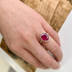 14k yellow gold and diamond ring with a natural ruby oval center stone