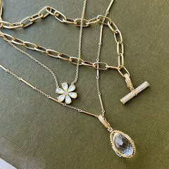 amulet pendant with other pieces arranged on a book