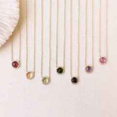 a selection of colored stone necklaces