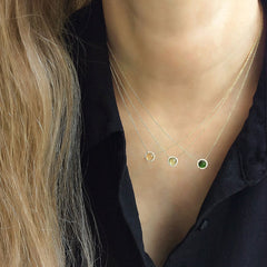 a selection of colored stone necklaces