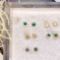 A selection of rosie post earrings in various colors