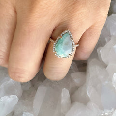 14k rose gold and diamond ring with a natural paraiba tourmaline center stone