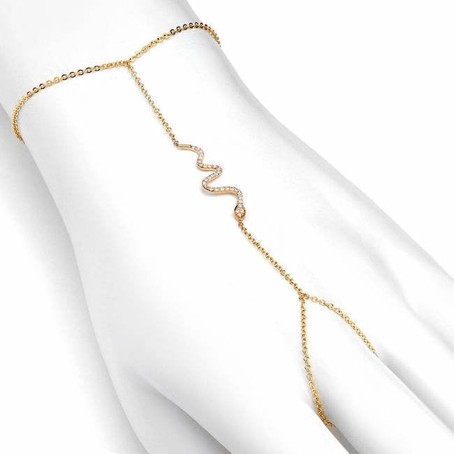 snake hand chain bracelet with diamonds in yellow gold
