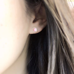 pink opal on ear