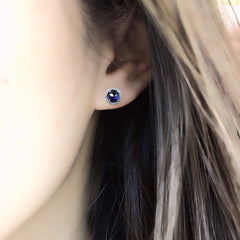blue corundum on ear