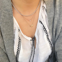 Classic layers with a tennis necklace