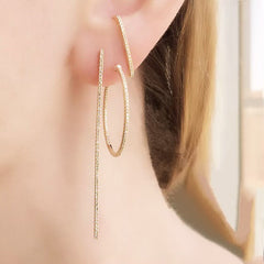 classic 25mm hoops worn with our lobe cuff post and long stick diamond earring for a cool modern look