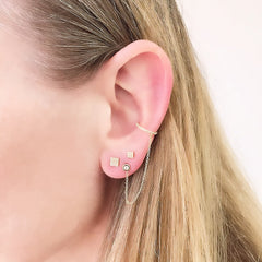 a layered ear look with an illusion cuff