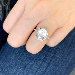 gorgeous oval white topaz ring on a hand