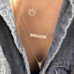 petite sunshine necklace worn layered with other liven encklaces