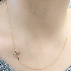 sideways cross necklace in 14k yellow gold with diamonds and black rhodium
