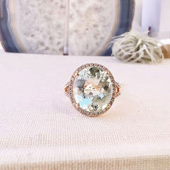 Split shank ring with an oval amblygonite center in rose gold
