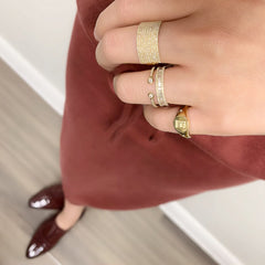 Double Bezel Diamond Open Halfway Band in yellow gold worn with other Liven rings