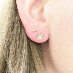 petite dog bone post earrings worn with the pawprint posts