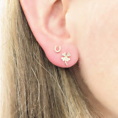 four leaf clover diamond earrings with a mini horseshoe
