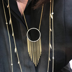large open circle with pave diamonds and fringe of gold chains