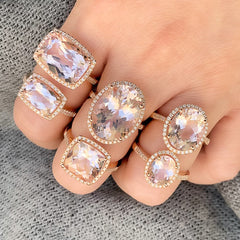 selection of morganite rings set in 14k gold with diamonds