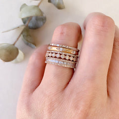 heirloom baguette diamond halfway band stacked with other liven rings