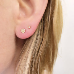 petite round pave post earrings with diamonds on ear