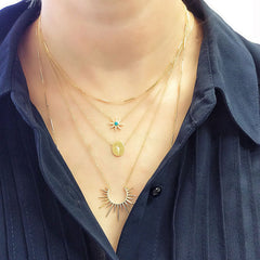 layered necklaces featuring the unity chain, sunburst turquoise, oval disc and large sunburst