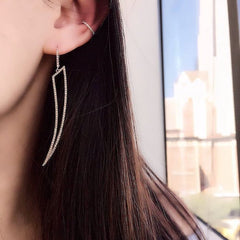open horn earrings on ear