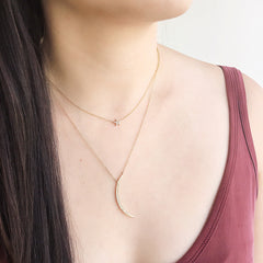 crescent moon necklace layered with star necklace