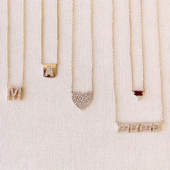 mama necklace layered with other liven pieces