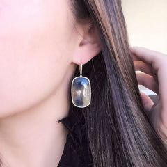 sapphire one of a kind earrings on ear