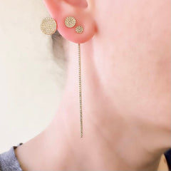 double circle jacket earrings in yellow gold as part of an edgy earscape
