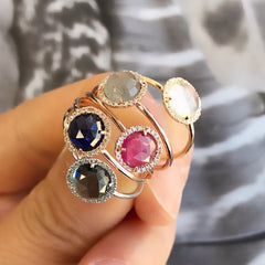a bouquet of rosie colored stone rings