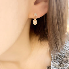 mini pave dangle earrings in solid 14k gold with diamonds on ear