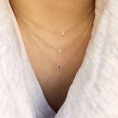 triple leayer of necklaces featuring the souli, petite star and evil eye