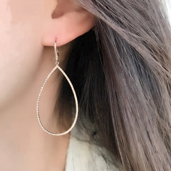 open pear shape diamond earrings