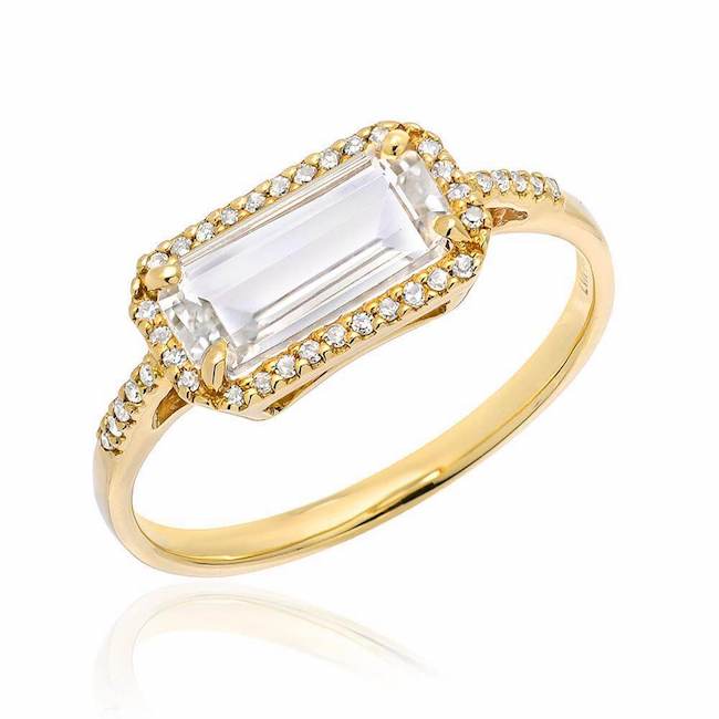 east west emerald cut white topaz ring in yellow gold