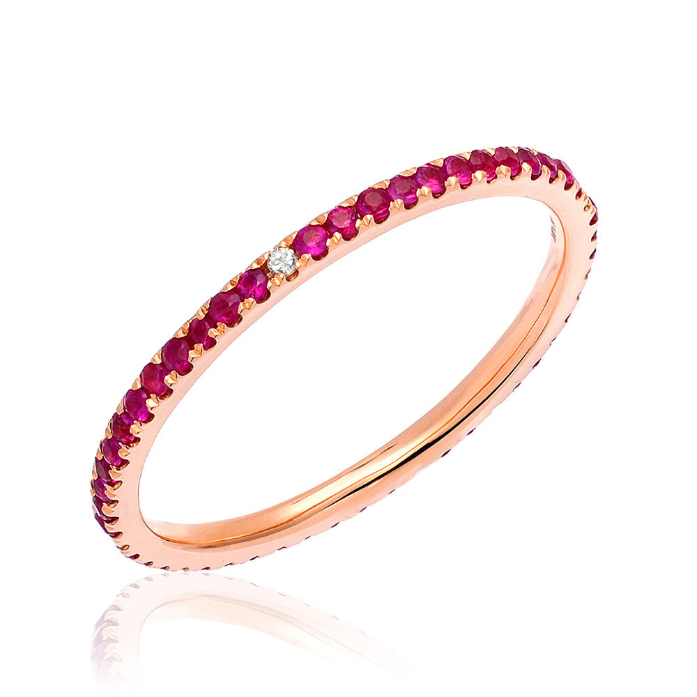 Ruby eternity band with compass point diamonds in rose gold