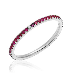 Ruby eternity band with compass point diamonds in white gold