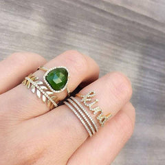 Kind ring shown stacked with other rings