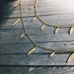 willow necklace layered with other liven necklaces